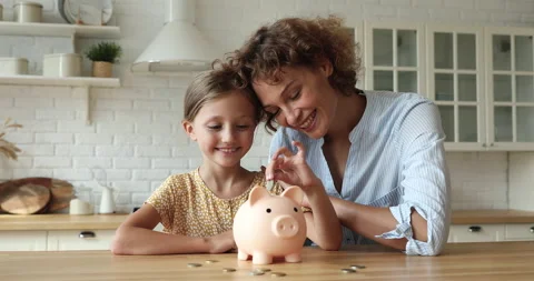 Little girl learn save money puts coins Stock Video Pond5