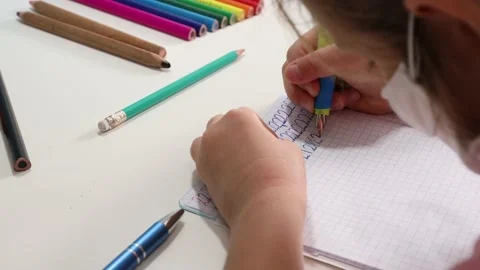 Little Girl is learning to write numbers. Stock Footage 140683967