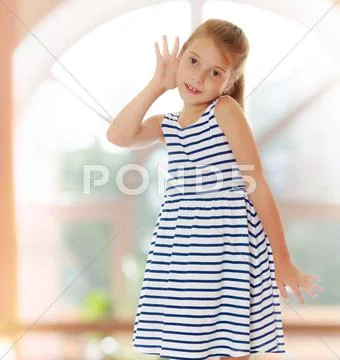 Little girl listens to Stock Photos