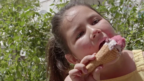 Little Girl Looking at Camera While Eating Ice Cream 6 스톡 동영상 196815213