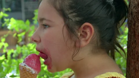 Little Girl Looking at Camera While Eating Ice Cream 5 스톡 동영상 196821435