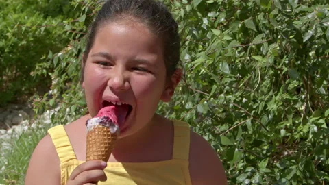 Little Girl Looking at Camera While Eating Ice Cream 2 스톡 동영상 196825256