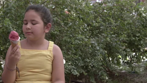 Little Girl Looking at Camera While Eating Ice Cream 8 스톡 동영상 196826915