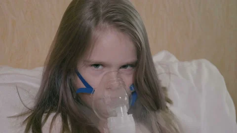 Little girl makes allergy inhalationbeautiful little girl makes allergy Stock Footage