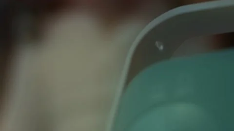 Little girl makes inhalation using a compressor inhaler while sitting on a sofa Stock Footage 145770812