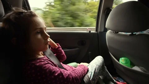 Little Girl Making Comfortable On Back Seat Of Car Vídeo Stock 81511079