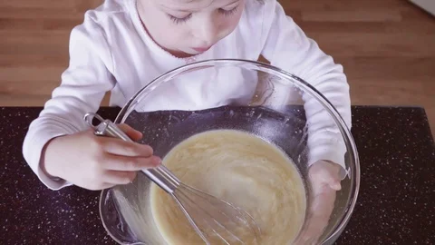 Little girl mixing dough for home made p... | Stock Video | Pond5