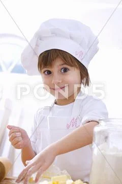 Little girl mixing pastry ingredients Stock Photos