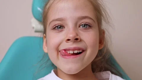 Little girl performs articulation exercises for mouth, speech disorders concept Stock Footage 307460156
