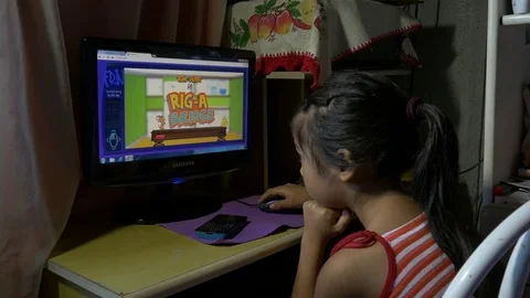 Little girl playing on the computer Stock Footage 70161528