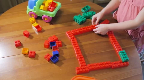 Little girl playing in constructor Video stock 61380761