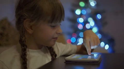 Little Girl Playing Games on Tablet Computer Stock Footage 59572479