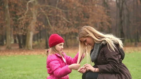 Little girl playing with her mother's hair Stock Footage 59554183