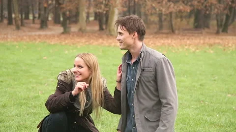 Little girl playing with her parents in park Stock Footage 59554153