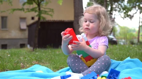 Little girl playing in nature Stock Footage