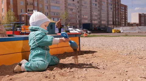 Little girl playing in the sandbox Stock Footage 59100232