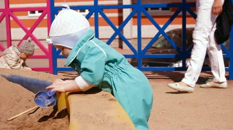 Little girl playing in the sandbox Stock Footage 59127435