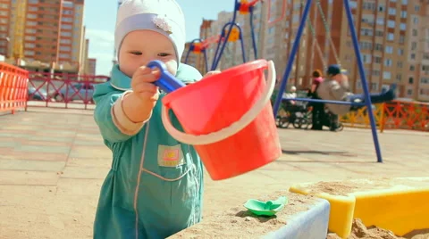 Little girl playing in the sandbox Stock Footage 59128260