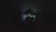 Little Girl Playing Tablet, Computer, Child Surfing Internet On Ipad, Night Dark Stock Footage