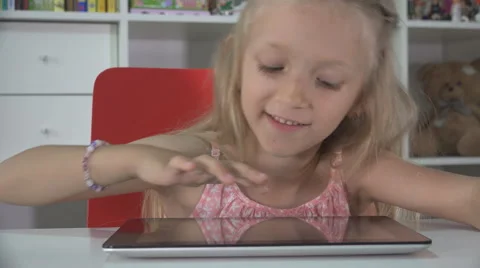 Little Girl Playing Tablet, Computer, Child Surfing Internet on Ipad, Kid Office Stock Footage 41611366
