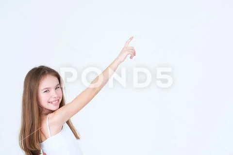 Little girl point hand index finger advertisement Stock Photos