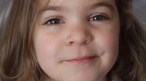 Little girl pulling a face Stock Footage 8880905