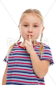 Little girl showing silence sign Stock Photos