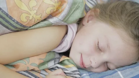 little girl sleeping on a pillow in the ... | Stock Video