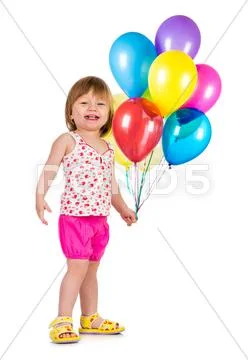 Little girl smiling with balloons. Stock Photos
