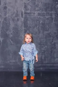 Little girl stands Stock Photos