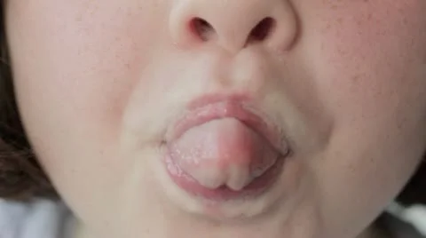 Little girl sticking tongue out | Stock Video