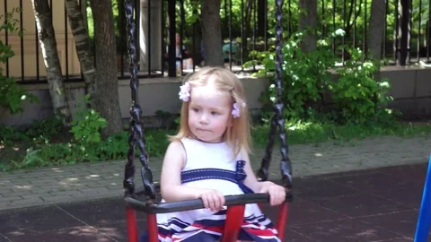 Little girl straightens her hair Stock Footage