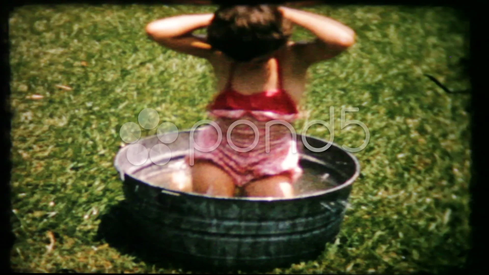 little girl takes bath in washtub in backyard 1950s vintage film home movie  181