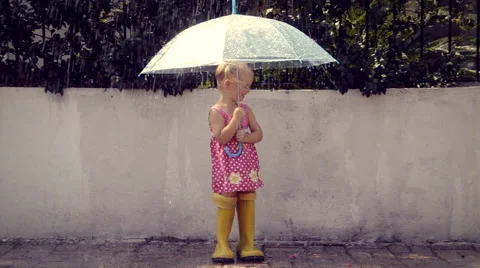 Little girl under the rain Stock Footage