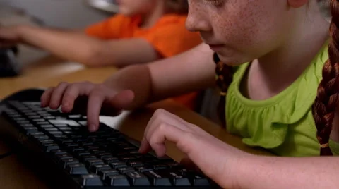 Little girl using computer in classroom in school 스톡 동영상 40407693