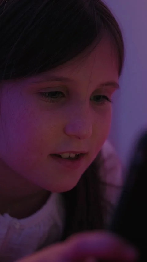 Little Girl Using Smartphone at Bedtime in Dark Room Stock Footage 345528454