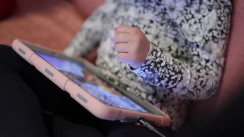 Little Girl Using Tablet While Laying In Sofa. Close Up Stock Footage 232896082