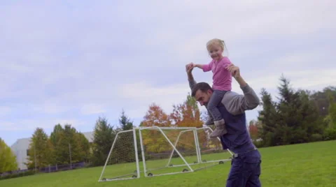 Little girl waves while on dads shoulders Stock Footage 58483658