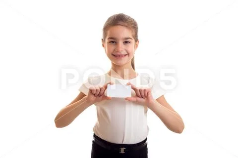 Little girl in white T-shirt holding white card Stock Photos