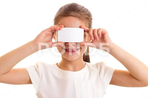 Little girl in white T-shirt holding white card Stock Photos
