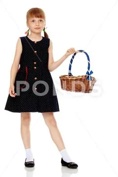 Little girl with a wicker basket Stock Photos