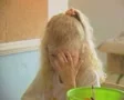 Little girls sitting at table colouring in with crayons SD Footage