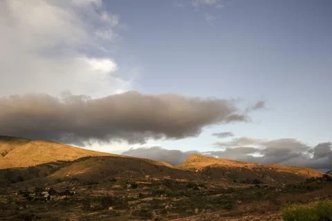 A little gray cloud hangs over a segment of the eastern Andes range near the  Stock-Fotos