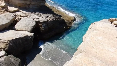 A little grey beach hidden between the rocks of Triopetra in Crete, Greece Stock-Footage 77138124