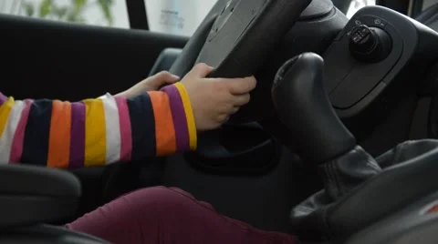 Little hands behind the steering wheel Stock Footage 42950152