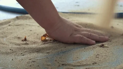 Little hands playing with the sand Stock Footage 79927249