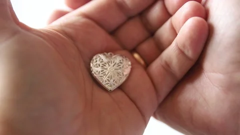 Little heart in the palms Stock Footage 123490571