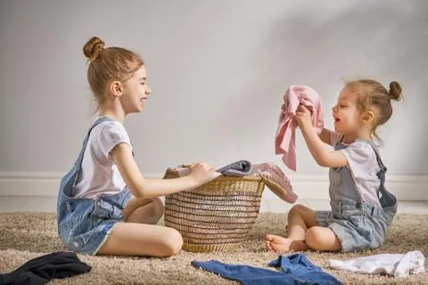 Little helpers doing laundry Stock Photos