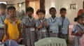 Little Indian girl crossing her arms at school in India HD Footage