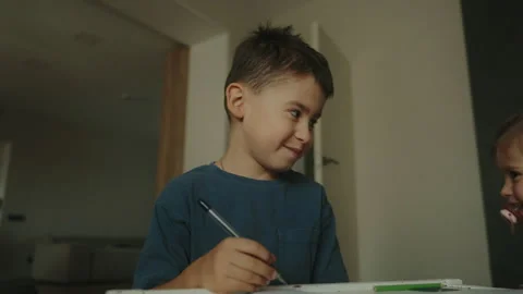 Little kid boy at home making homework at the morning before the school starts Stock Footage 252248442